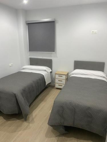 Postel nebo postele na pokoji v ubytování Apartamento Patricia
