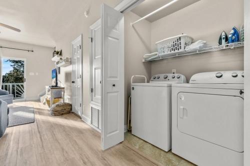 a laundry room with a washer and dryer at Big Blue Cottage 2A in Gulf Shores