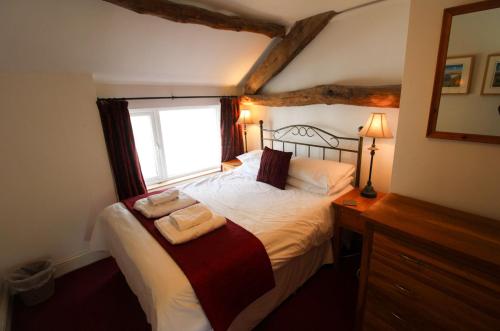 Un pat sau paturi într-o cameră la Bassenthwaite Cottage, Bassenthwaite