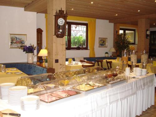 a buffet line with food on it in a restaurant at Hotel Rebstock in Ohlsbach