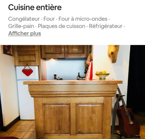 a kitchen with a wooden counter top in a kitchen at La terrasse du mont Blanc in Cordon