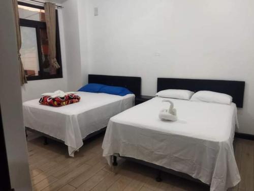 Cama ou camas em um quarto em Hotel Posada Lucia