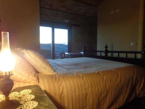 A bed or beds in a room at Cascina Romanino
