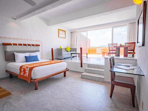 Postel nebo postele na pokoji v ubytování Las Brisas Huatulco-All Inclusive