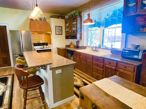 a kitchen with a sink and a counter top at Bed & Breakfast private room near Amish Country in Elkhart