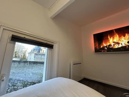 Katil atau katil-katil dalam bilik di Le Paddock - COSY FLAT Senlis