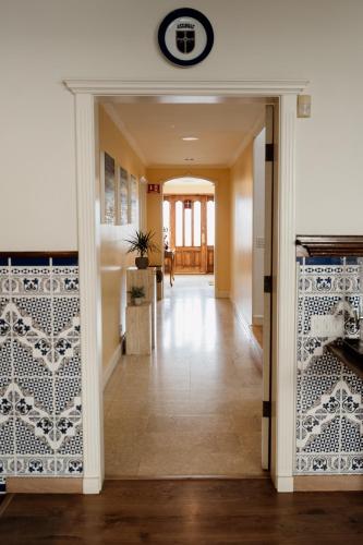 a hallway of a home with a tile wall at Casa Asturias in Ensenada