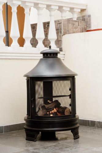 a black stove with a fire inside of it at Casa Asturias in Ensenada