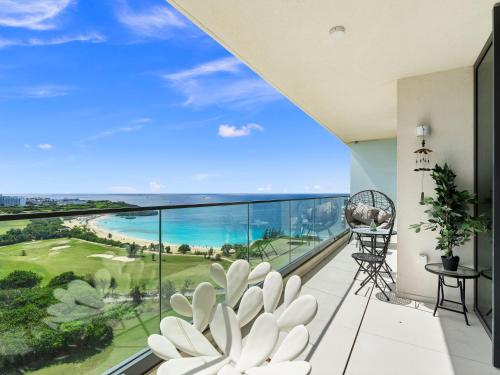 a balcony with a view of the ocean at Fourteen at Mullet Bay in Cupecoy