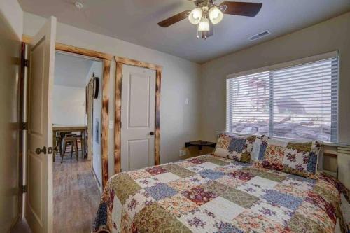 a bedroom with a bed and a ceiling fan at Angel Rock Rentals of Moab Unit 5 in Moab