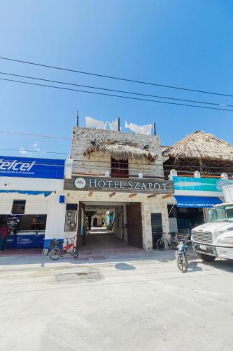 an old hotel sarrett building on a street at Hotel Szapot in Bacalar