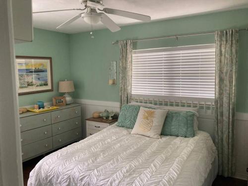 a bedroom with a bed and a ceiling fan at Chic 3BR Home w/ Big Yard in Winter Park-Orlando in Orlando