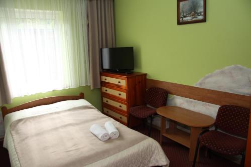 Voodi või voodid majutusasutuse Willa Larysa Centro toas