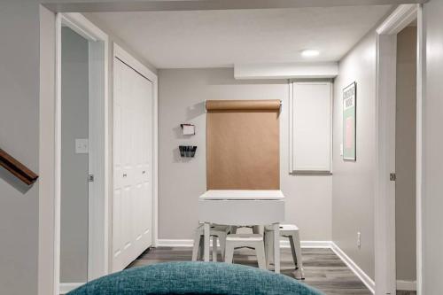 a room with a table and two stools in it at UNL Retreat Eclectic 5bd 5mins to Downtown in Lincoln