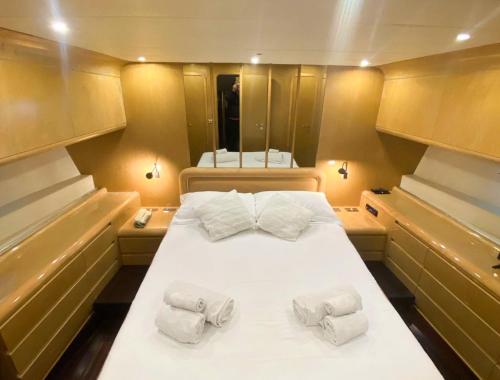 a large bed in the middle of a boat at BB Boat Lady A in Genova