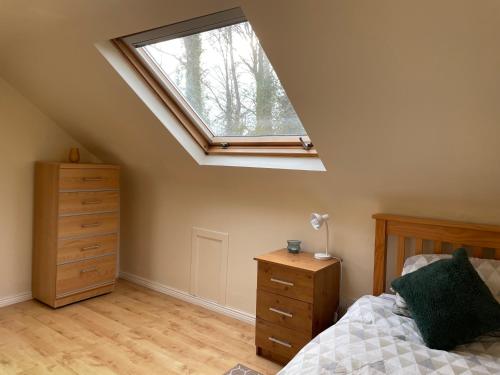 A bed or beds in a room at Fairway House