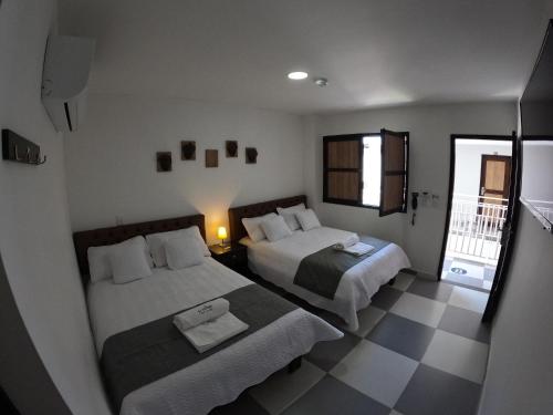 Lova arba lovos apgyvendinimo įstaigoje Hotel El Olimpo