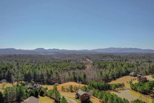 an aerial view of a farm with a house and trees at Mtn View•Hot Tub•Firepit•Game Rm•10min to Blue Ridge in Morganton