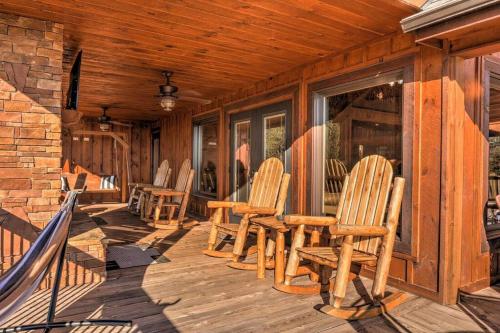 a porch with chairs and a table on a cabin at Mtn View•Hot Tub•Firepit•Game Rm•10min to Blue Ridge in Morganton