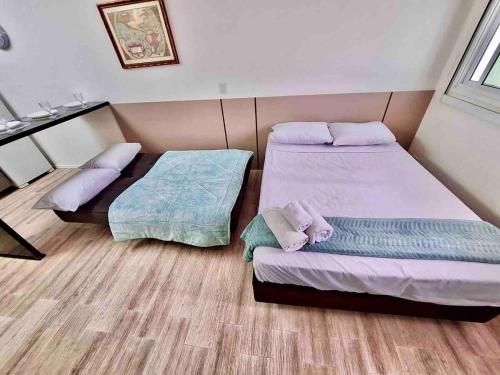Cama o camas de una habitación en 302B · Condomínio de Sonho em Localizaçao privilegiada