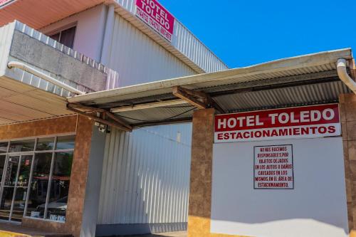 a hotel toledo sign in front of a building at Hotel Toledo in David