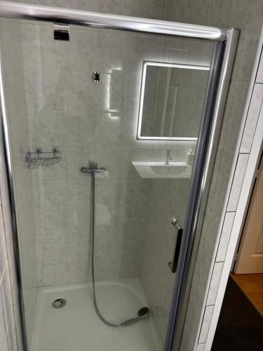 a bathroom with a shower and a sink at Maison Luna in Salies-de-Béarn