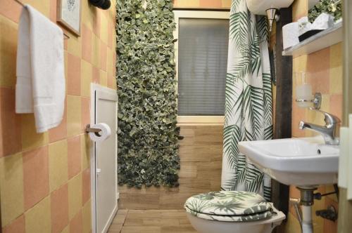 a bathroom with a sink and a toilet in it at Jungle 13 - Room and Apartments in Naples