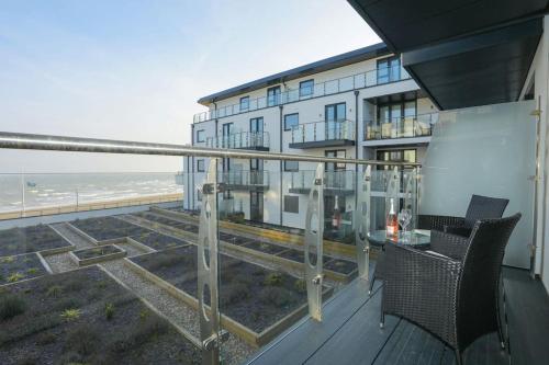 a balcony of a building with a view of the ocean at SoHot Stays Beach Haven Apt With Sea Views A Balcony & Free Parking in Ramsgate