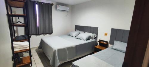Katil atau katil-katil dalam bilik di Maravilhoso flat de Tambaú