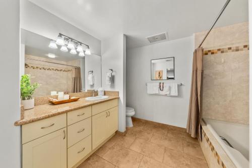 a bathroom with a sink and a toilet at Kaanapali Royal H101 · KRL H101 Remodel 2BD Condo Pool Kaanapali in Kaanapali