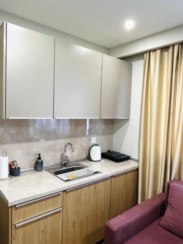 a kitchen with a sink and a counter top at Urban Residence Apartments in Mostar