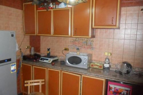 Η κουζίνα ή μικρή κουζίνα στο شقة مفروشة للايجار