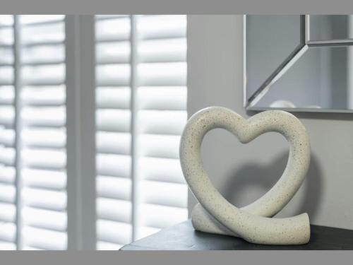 a statue of a heart sitting on a table at The Case in Point in Witney