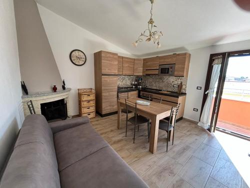 a living room with a couch and a table at Palazzo Pisano Sorso-Tourist Rental in Sorso