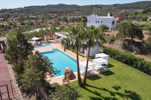 an aerial view of a villa with a swimming pool at Private Family Size Villa in Nature with Tennis, Basketball and Football Courts for Holidays and Retreats in Sant Rafael de Sa Creu