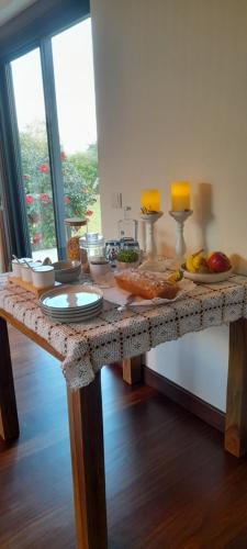 a table with food on top of it at Quinta Alto da Fraga in Vila Nova de Foz Coa