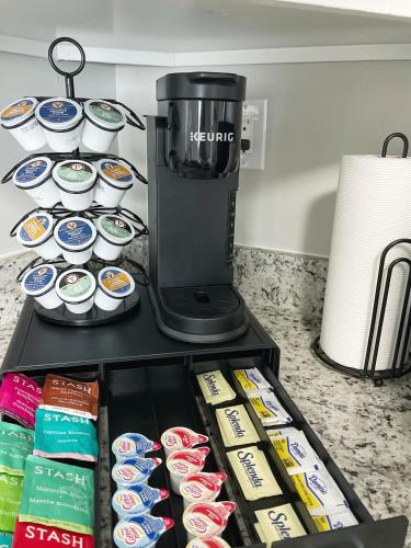 a coffee maker sitting on top of a counter with food at *NEW* The Cozy Haven, 5 minutes to ATL airport in Atlanta