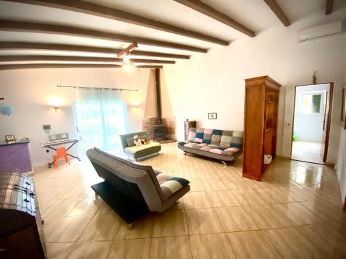 a living room with a couch and a fireplace at Casa de Estrella in Costitx