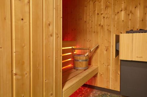 a small wooden room with a bucket in it at Scandic Berlin Potsdamer Platz in Berlin