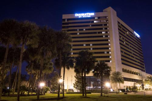 a building with a sign on it at night at DoubleTree by Hilton Orlando Downtown in Orlando