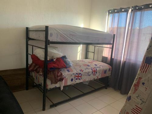מיטה או מיטות קומותיים בחדר ב-Casa vacacional