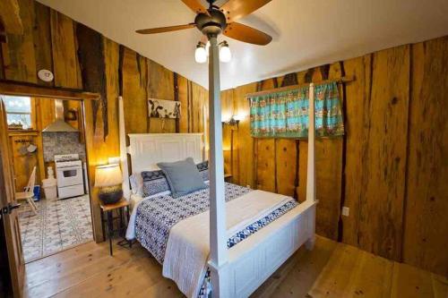 a bedroom with a bed and a ceiling fan at Pacific Coast Highway Milkhouse in San Luis Obispo