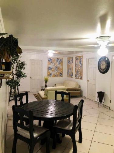 a living room with a table and chairs and a couch at Casa Peninsula in San Felipe