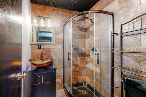 a bathroom with a glass shower and a sink at The Onyx in Walla Walla