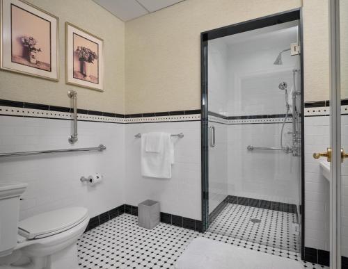 a bathroom with a shower and a toilet at The Northport Hotel in Northport