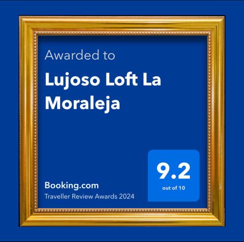 a gold picture frame with a blue background at Lujoso Loft La Moraleja in Madrid