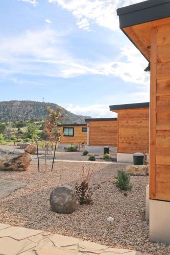 a house with a gravel yard with a building at Escalante Escapes Star Lily- Bunk Escape in Escalante