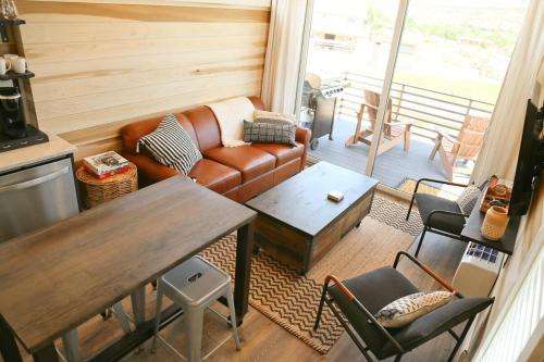 a living room with a couch and a table at Escalante Escapes Wild Rose- King Escape in Escalante