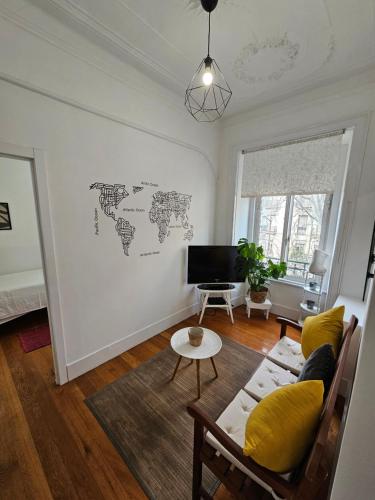 a living room with a couch and a television at Almirante GuestHouse in Lisbon