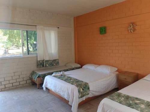 Cama o camas de una habitación en Hotel El Trebol